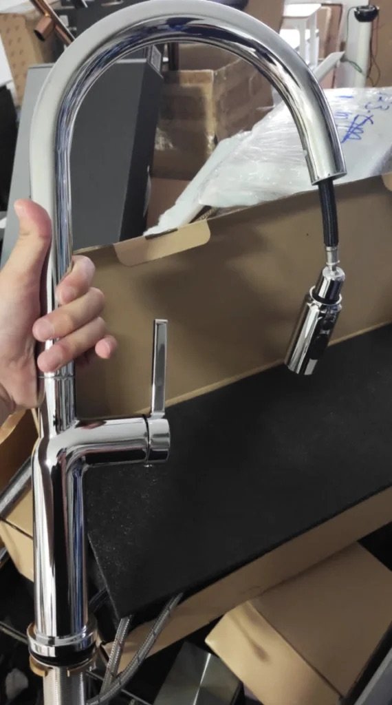 Chrome kitchen mixer tap with a pull-out spray head
